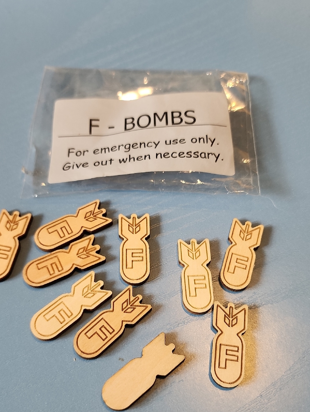 F-Bombs Wooden  Tokens - Light Natural Wood 9 Bombs & 1 Blank